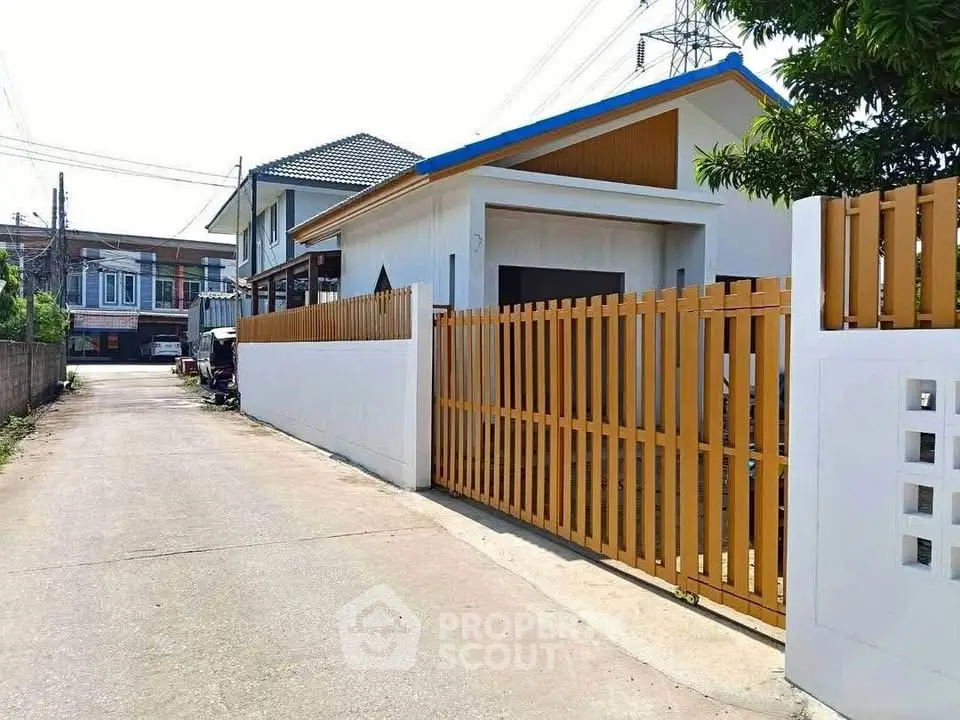 Charming suburban house with modern design and spacious driveway, perfect for family living.