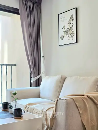 Cozy living room with elegant decor and natural light, perfect for relaxation.