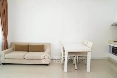 Modern minimalist living room with beige sofa and dining table in open layout