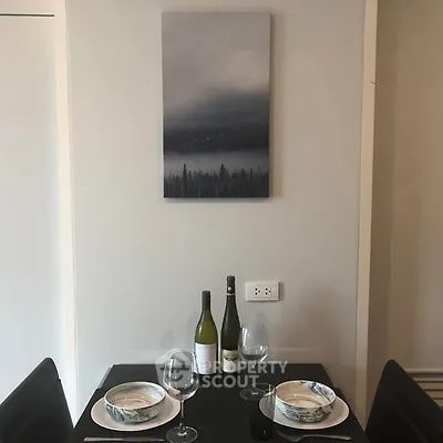 Chic dining nook with elegant table setting and modern art decor