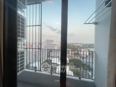 Stunning high-rise balcony view with cityscape and open sky, perfect for urban living.