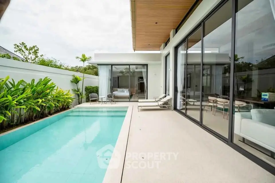 Luxurious modern villa with private pool and spacious patio, perfect for relaxation and entertaining.