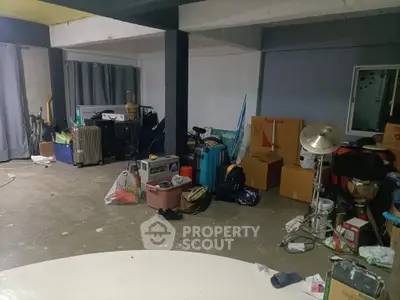 Spacious storage area with various items and boxes, ideal for organizing and decluttering.