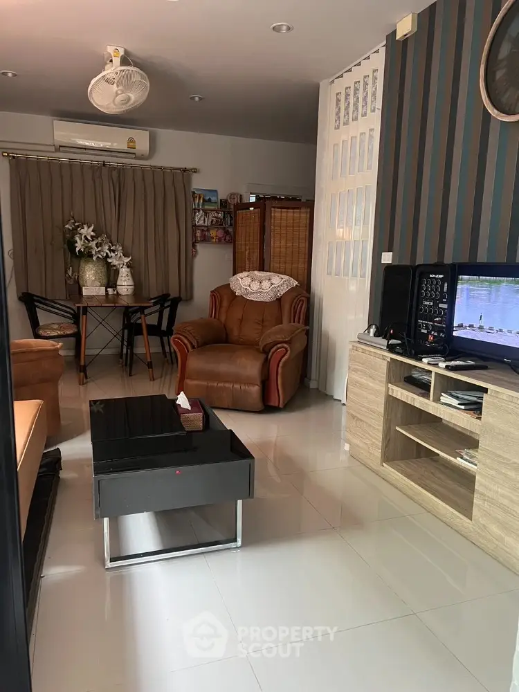 Cozy living room with modern furniture and stylish decor, perfect for relaxation and entertainment.