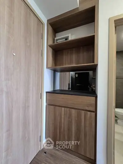 Modern wooden storage unit in a stylish apartment entryway