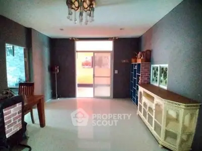 Spacious living room with modern decor and large windows for natural light.