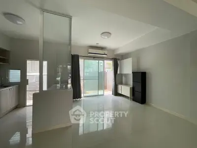 Spacious modern living room with large windows and sleek design