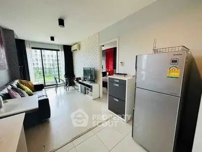 Modern living room with balcony view and sleek furniture in a stylish apartment.