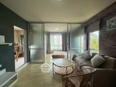 Spacious living room with modern decor and natural light