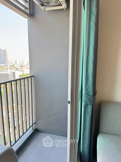 Charming urban balcony with city view, perfect for relaxation and enjoying the skyline.