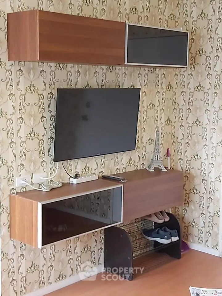 Stylish living room with modern TV unit and elegant wallpaper