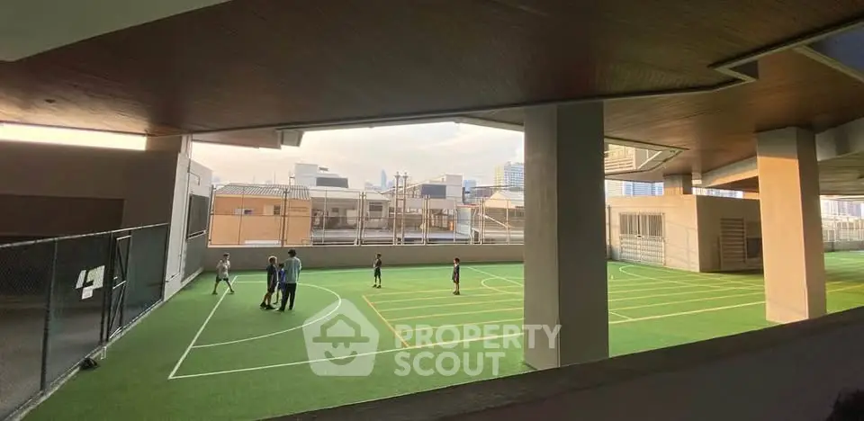 Spacious rooftop sports court with city views, perfect for active urban living.