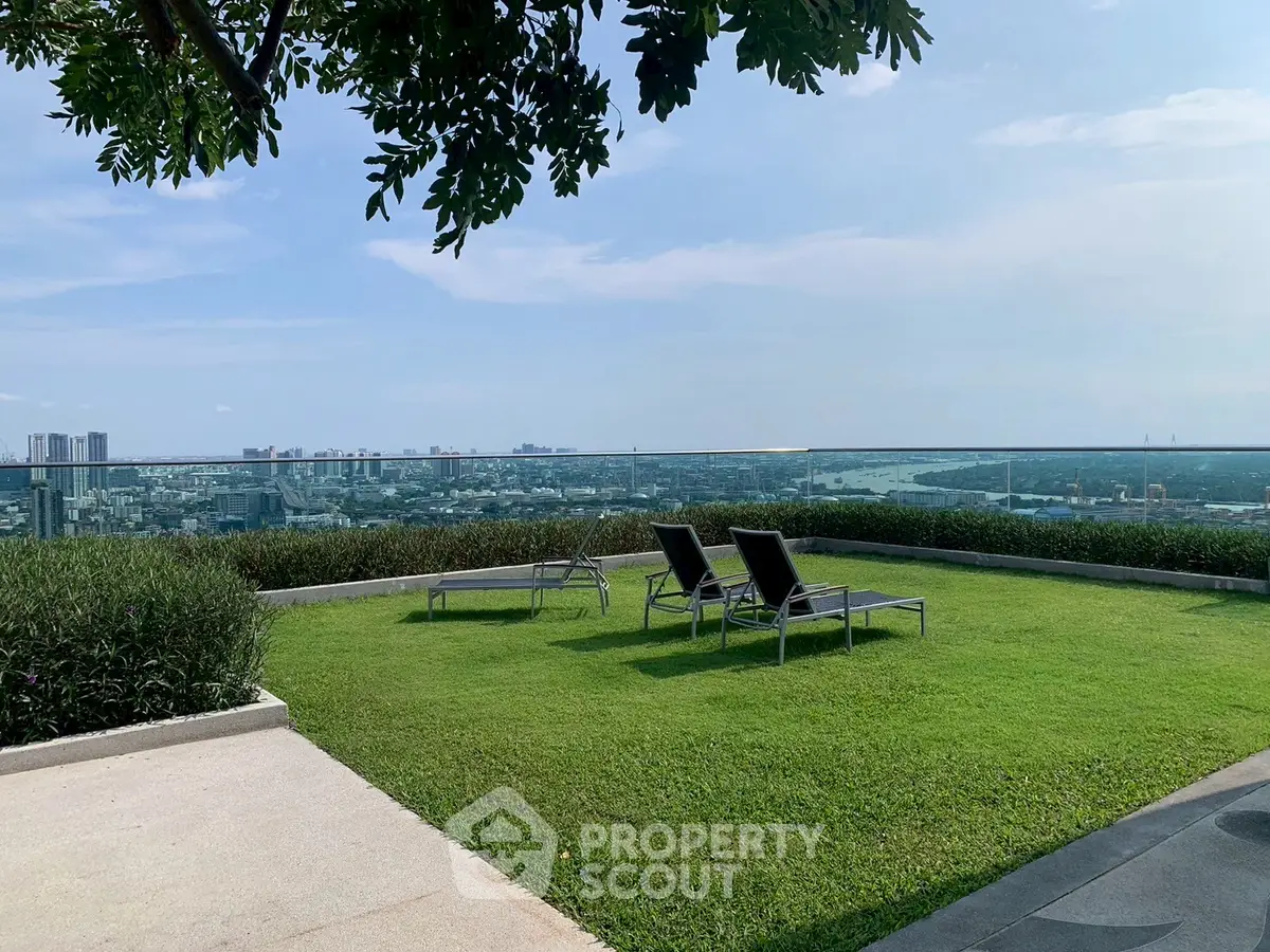 Stunning rooftop garden with panoramic city views and relaxing lounge chairs.