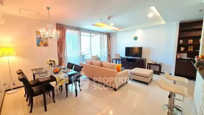 Spacious and elegant living room with dining area, modern decor, and ample natural light.