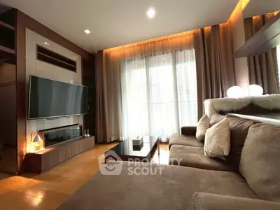 Luxurious living room with plush sofa and modern entertainment center, featuring floor-to-ceiling windows and ambient lighting.