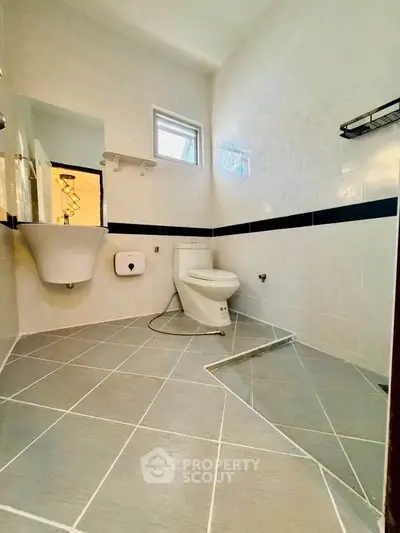 Modern bathroom with sleek design and stylish fixtures in a contemporary home.