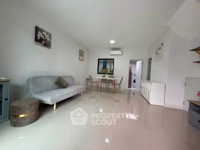 Spacious modern living room with sleek furniture and polished tile flooring