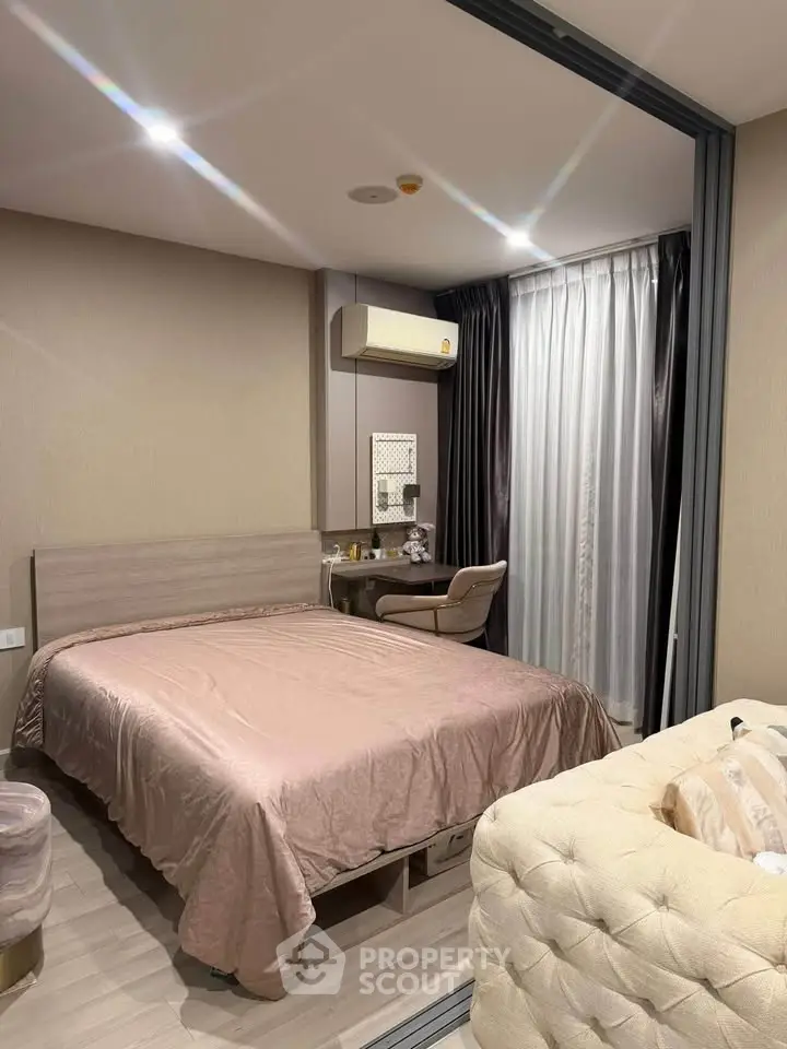 Modern bedroom with stylish decor and cozy ambiance in a contemporary apartment.
