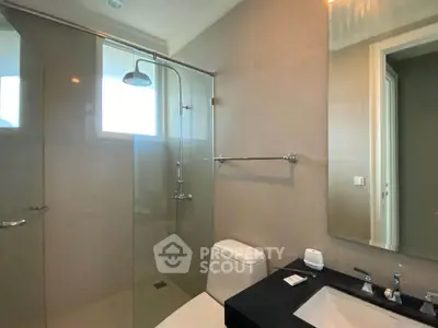 Modern bathroom with sleek shower and elegant fixtures