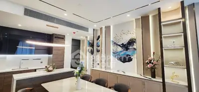 Luxurious modern kitchen with elegant decor and open layout, featuring sleek cabinetry and stylish lighting.