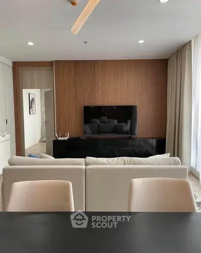 Modern living room with sleek TV setup and elegant decor