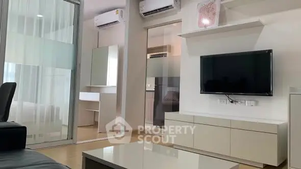 Modern living room with sleek furniture and air conditioning units