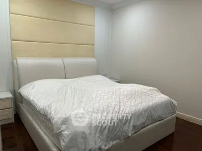 Spacious bedroom with elegant bed and modern design