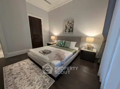Luxurious bedroom with elegant decor and cozy lighting, perfect for relaxation and comfort.