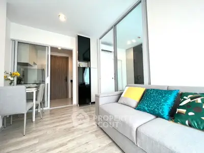 Modern living room with stylish decor and open kitchen layout