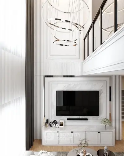 Luxurious modern living room with high ceilings and elegant chandelier