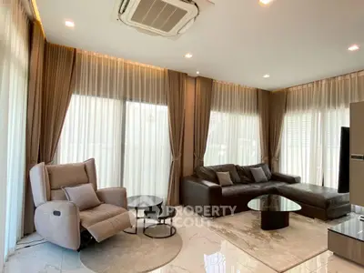 Luxurious modern living room with elegant curtains and plush seating