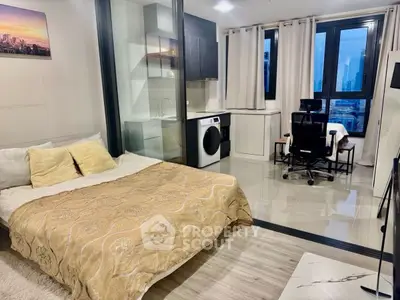 Modern studio apartment with bed, washing machine, and city view.