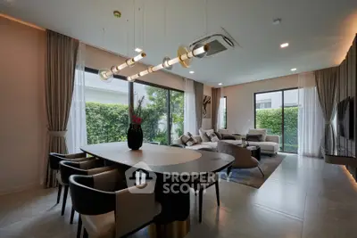 Luxurious modern living room with elegant dining area and large windows overlooking a lush garden.