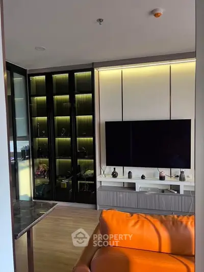 Modern living room with sleek TV setup and stylish shelving