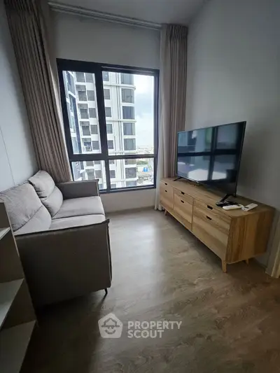 Cozy living room with modern sofa and large window view