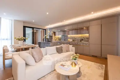 Luxurious open-plan living room with elegant decor and modern kitchen