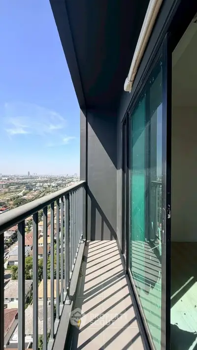 Spacious balcony with stunning city view from high-rise apartment