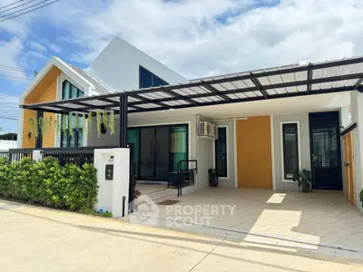 Modern single-story house with spacious driveway and contemporary design