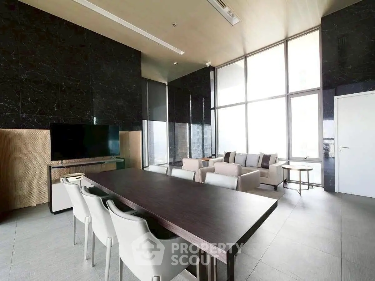 Luxurious modern living room with high ceilings and panoramic windows