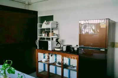 Cozy kitchen with modern appliances and wooden storage unit