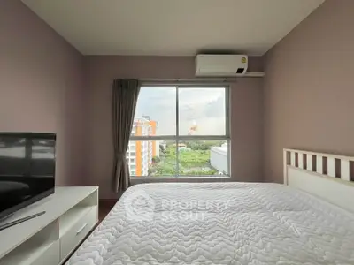 Cozy bedroom with large window offering a scenic view, featuring a comfortable bed and modern decor.