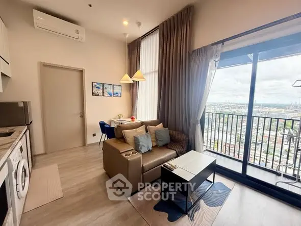 Modern living room with balcony view in high-rise apartment