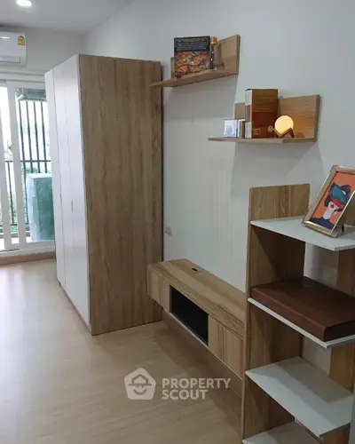 Modern living room with wooden furniture and balcony view