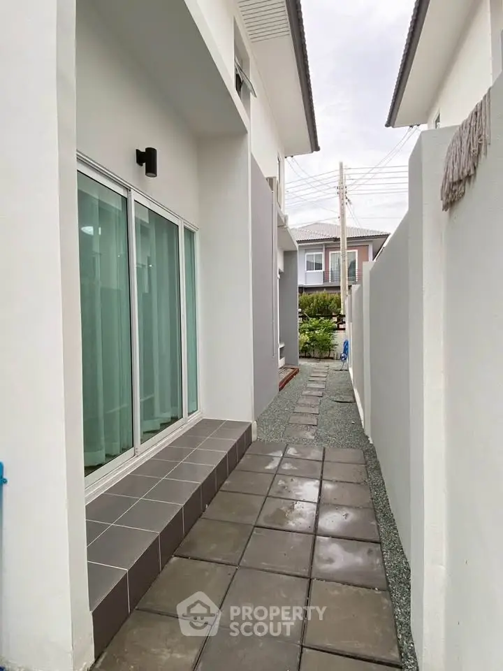 Modern exterior walkway with sleek design and clean lines in a contemporary home.