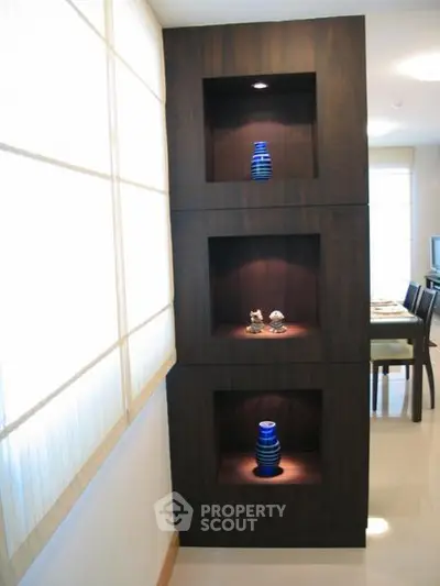 Modern interior with stylish built-in shelving and elegant decor accents