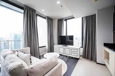 Modern living room with panoramic city view and stylish furnishings