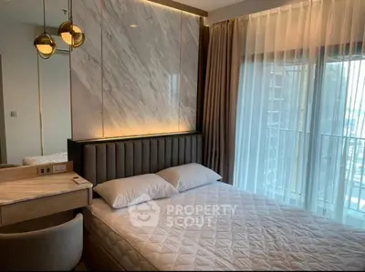 Luxurious bedroom with modern decor and large window view