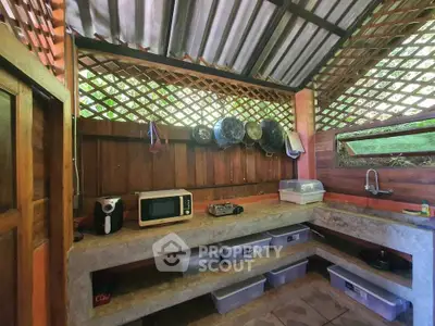 Rustic outdoor kitchen with wooden accents and modern appliances