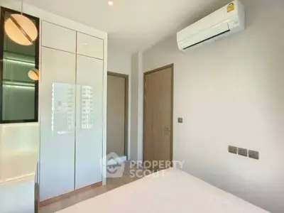 Modern bedroom with sleek design and air conditioning unit