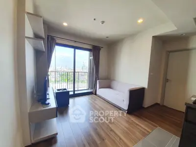 Modern living room with city view and sleek wooden flooring